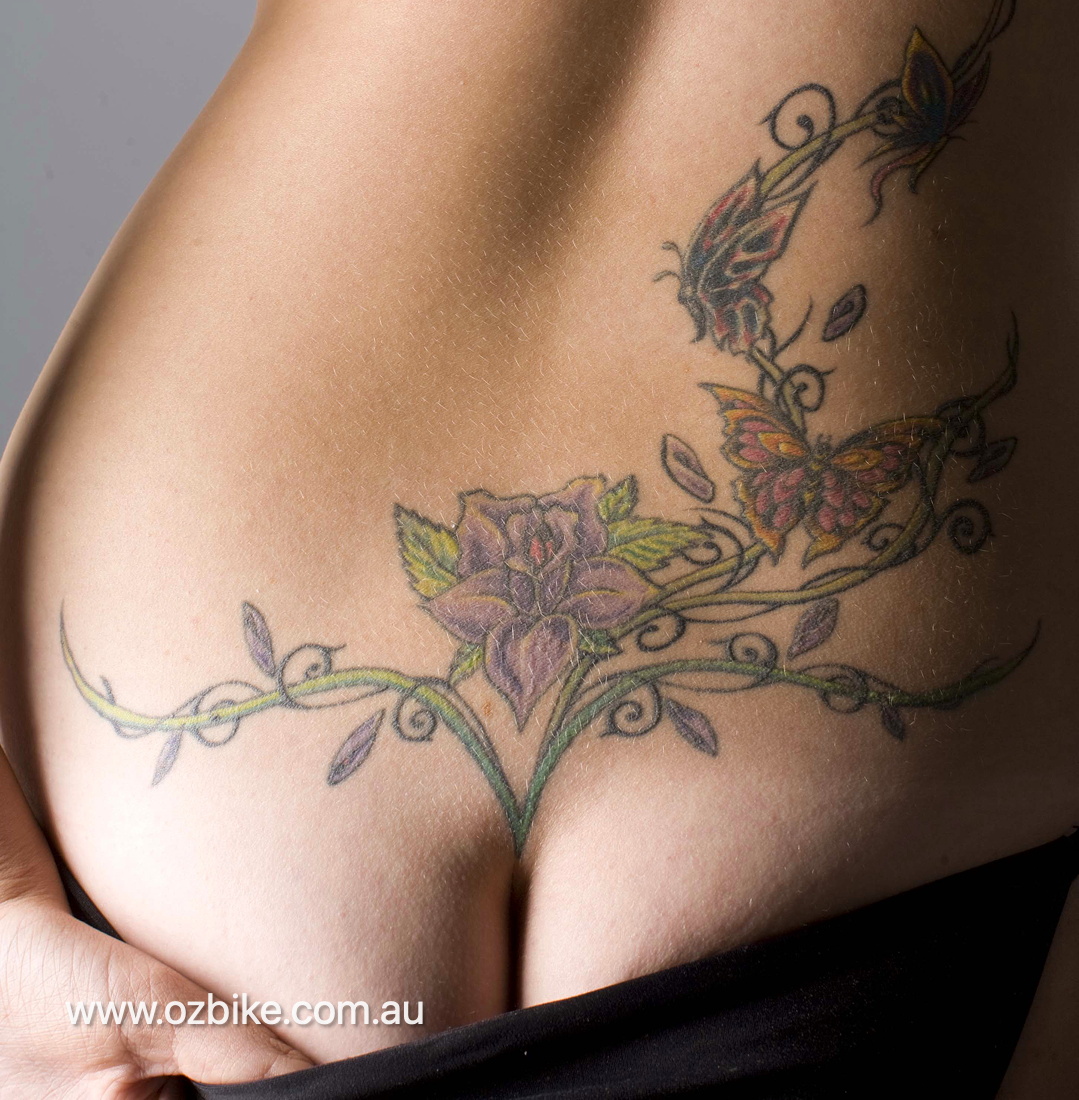tattooed girl on Harley-Davidson